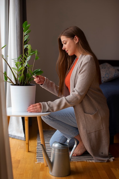 Photo full shot young woman spending time at home