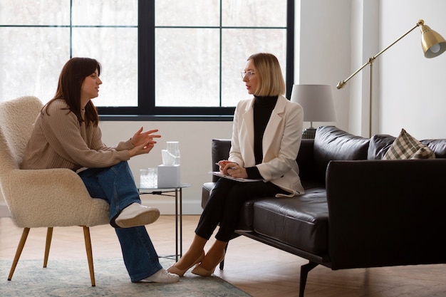 Full shot young woman undergoing therapy