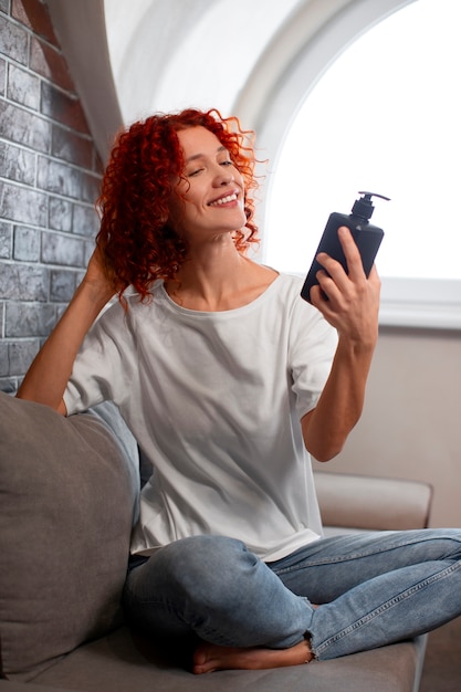 Full shot young woman with curly hair