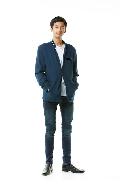 Photo a fullbody portrait of an early teenage boy smart slim tall asian man in casual clothes standing elegantly on white background