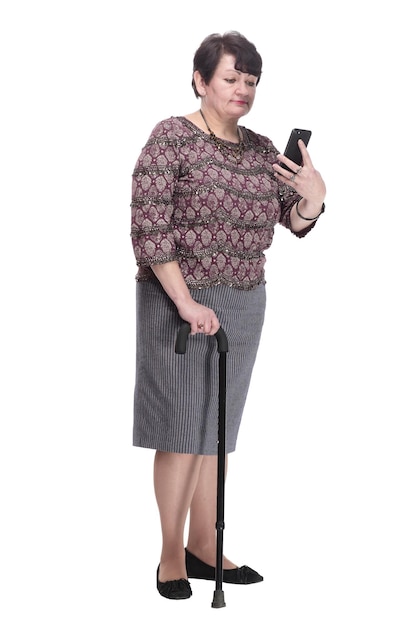 Fulllength casual elderly woman with a mobile phone