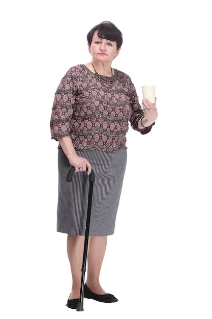 Fulllength casual elderly woman with takeaway coffee