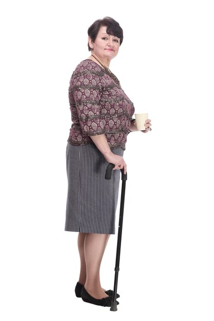 Fulllength casual elderly woman with takeaway coffee