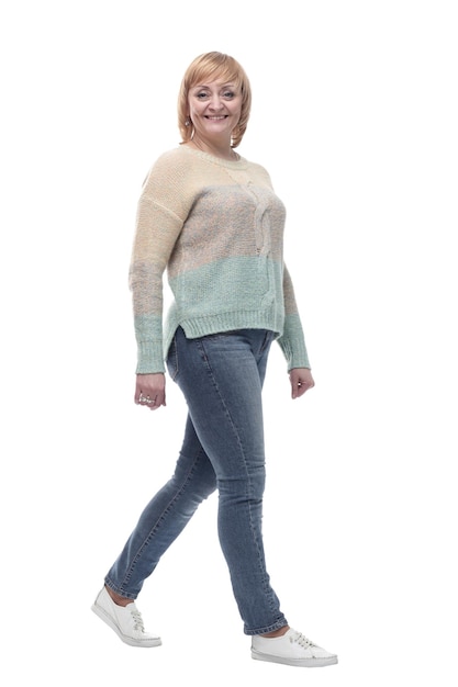 Fulllength casual woman in jeans striding forward