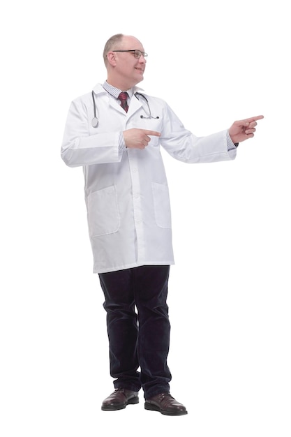 Fulllength mature doctor pointing the correct direction