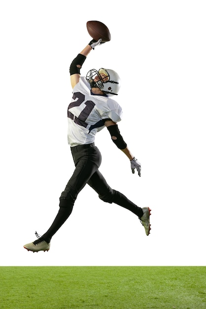 Fulllength portrait of professional american football player in uniform training jumping isolated