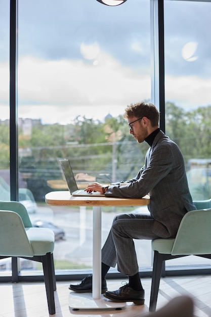 fulllength portrait of a successful programmer working on it software in a modern office interior