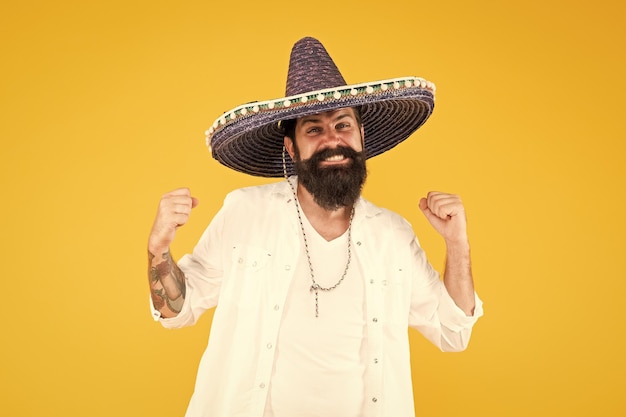 A fun accessory man in festive mood at party celebrating guy happy festive outfit his spanish costume cinco de mayo mexican celebration travel to mexico man in mexican sombrero hat