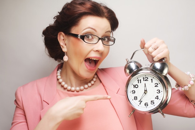  fun businesswoman with alarmclock