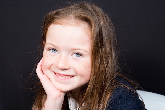 Fun Portrait of an Adorable young Girl on a white Background