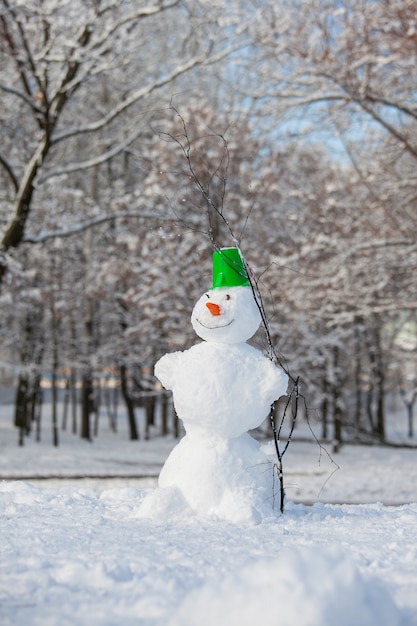 Fun snowman in park.