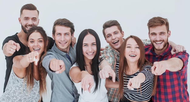 Fun team of young people pointing at you