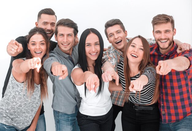 Fun team of young people pointing at you