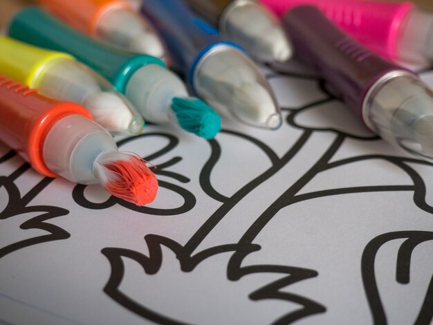 Fun for toddlers .Children's coloring pages and markers close-up