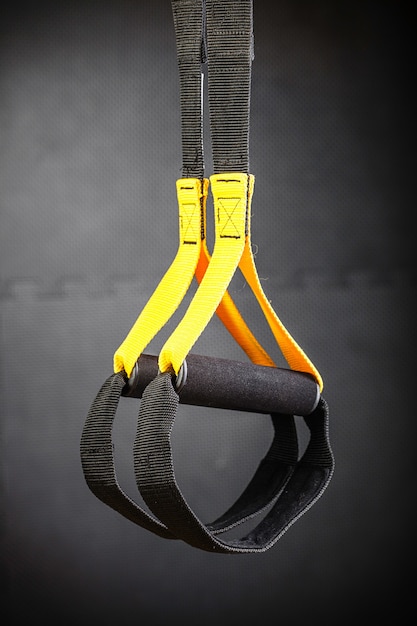 Functional training equipment hanging in front of dark