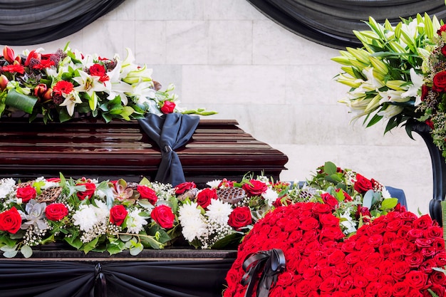 Funeral, beautifully decorated with flower arrangements coffin, close-up