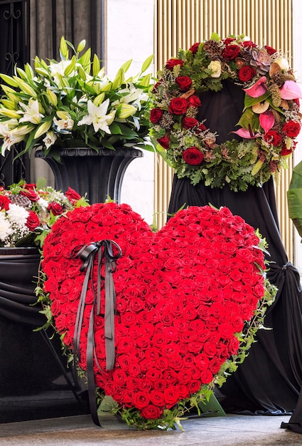 Funeral, beautifully decorated with flower arrangements coffin,\
close-up