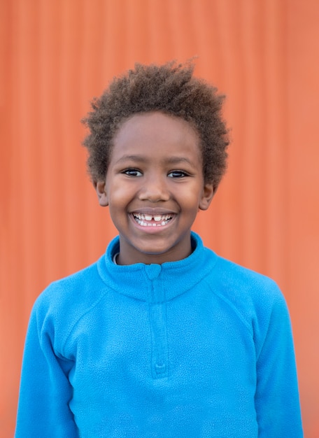 Funny african child with blue jersey