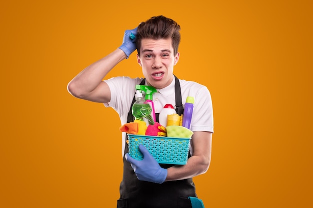 Funny boy choosing detergents