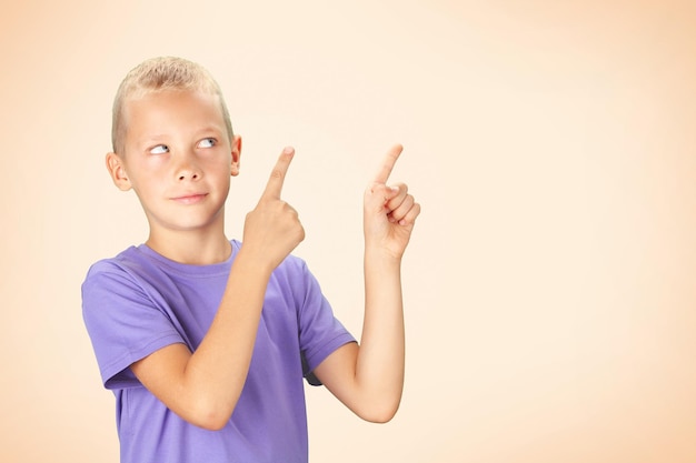 Funny boy pointing with hand and finger