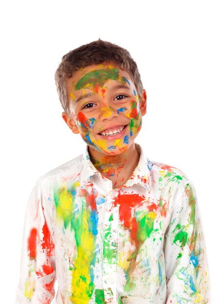 Funny boy with hands and face full of paint