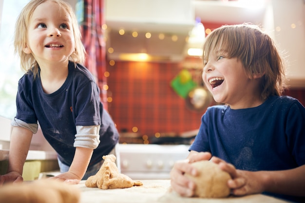 Funny boys are preparing the dough