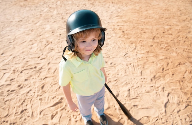 Photo funny child batter about to hit a pitch during a baseball game kid baseball ready to bat fun child