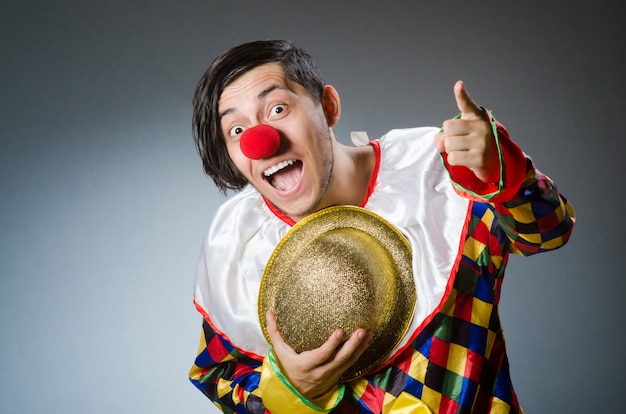 Funny clown on dark