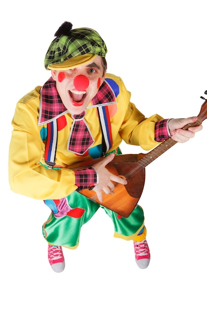 Funny clown with a balalaika isolated on a white background