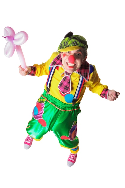 Photo funny clown with a pink flower from a  balloon isolated on the white background