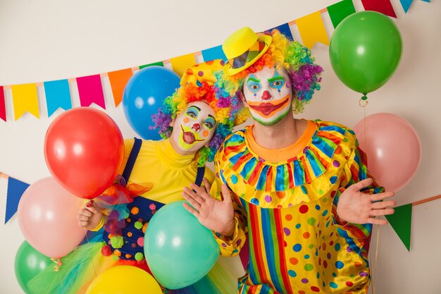 Funny clowns at a colorful party