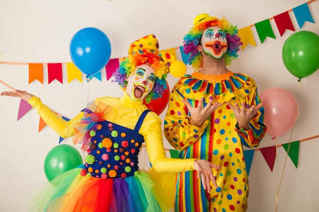 Funny clowns at a colorful party