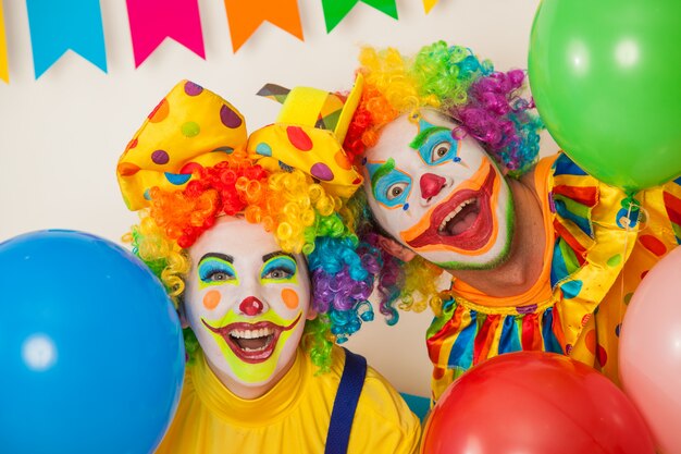 Funny clowns at a colorful party