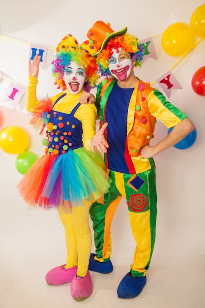 Funny clowns at the holiday show their good emotions