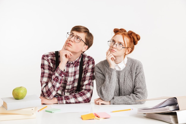 Funny couple of school nerds thinking