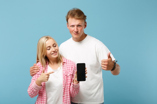 Funny couple two friends guy and woman posing 