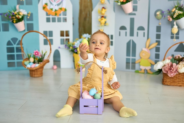 Funny cute girl in bunny ears celebrating Easter