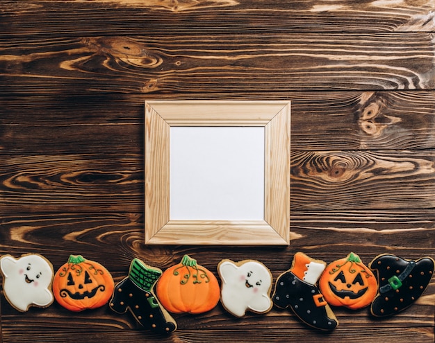 Funny delicious ginger biscuits for Halloween on the table. horizontal view from above