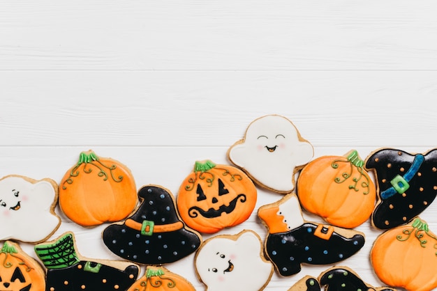 Funny delicious ginger biscuits for Halloween on the table. horizontal view from above