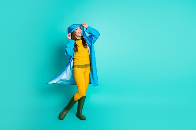 funny dreamy carefree lady in raincoat enjoy autumn weather