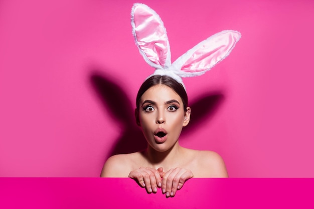 Funny emotions excited expressing Bunny woman isolated on pink