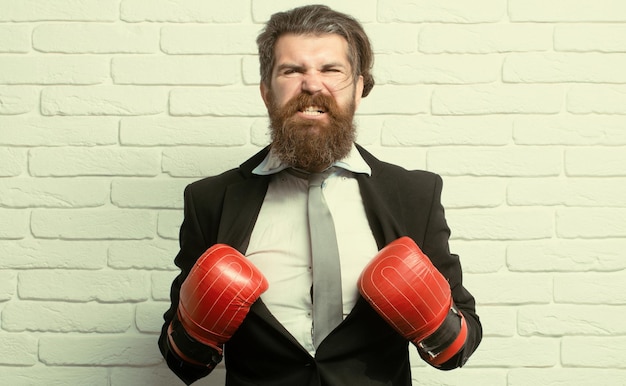 Funny excited businessman in boxing gloves disagreed business men aggressive and angry while conflic