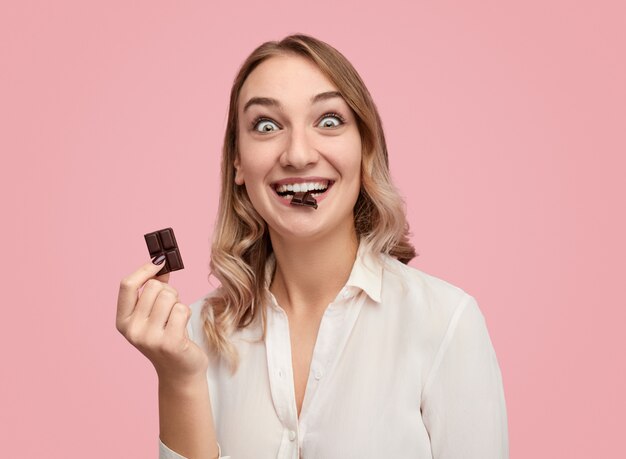 funny face lady biting chocolate