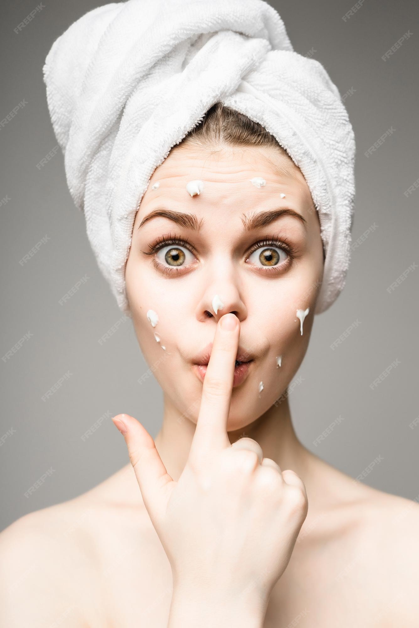 Premium Photo | Funny face portrait of beautiful woman applying some cream to her face for skin fresh clean skin. youth and skin care concept. isolated on a white background Premium Photo | Funny face portrait of beautiful woman applying some cream to her face for skin fresh clean skin. youth and skin care concept. isolated on a white background