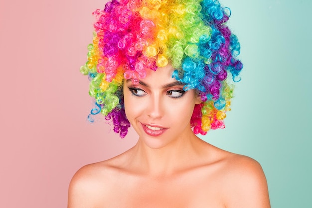 Photo funny girl clown rainbow wig funny laughing happy girl