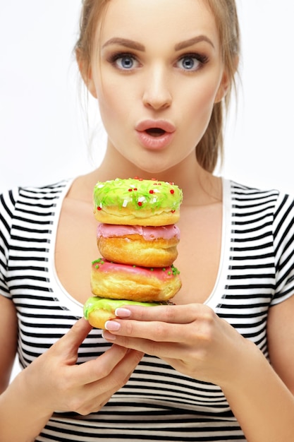 Funny girl and colorful donuts