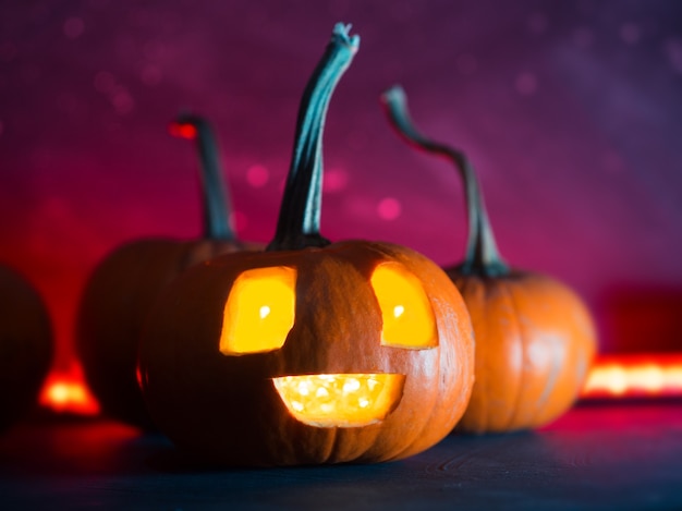 Funny Halloween pumpkin on a red background