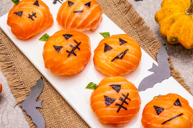 Funny Halloween Sushi Pumpkins Jack o Lantern, Sushi Monsters. Temari sushi, sushi balls. Healthy food for kids