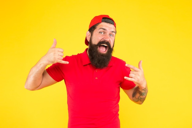 Funny happy guy Approve or recommend concept Man smile unshaven face shows thumbs up gesture yellow background Man happy cheerful face support or recommend Guy happy emotional expression