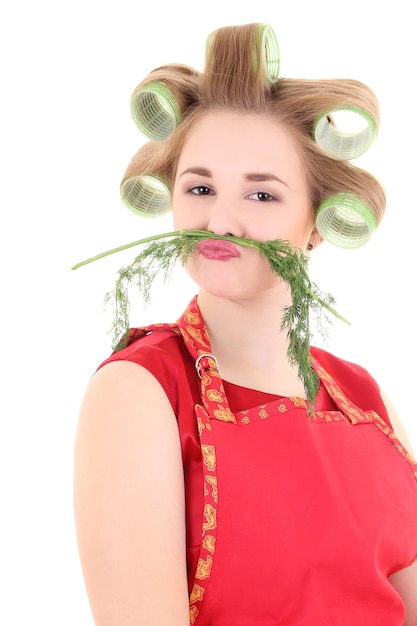 Funny housewife with hair curlers and dill mustache over white